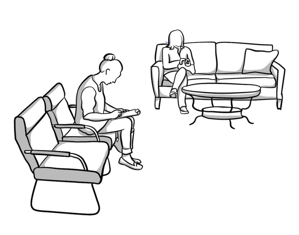 Persons seated in a waiting room filling out paperwork